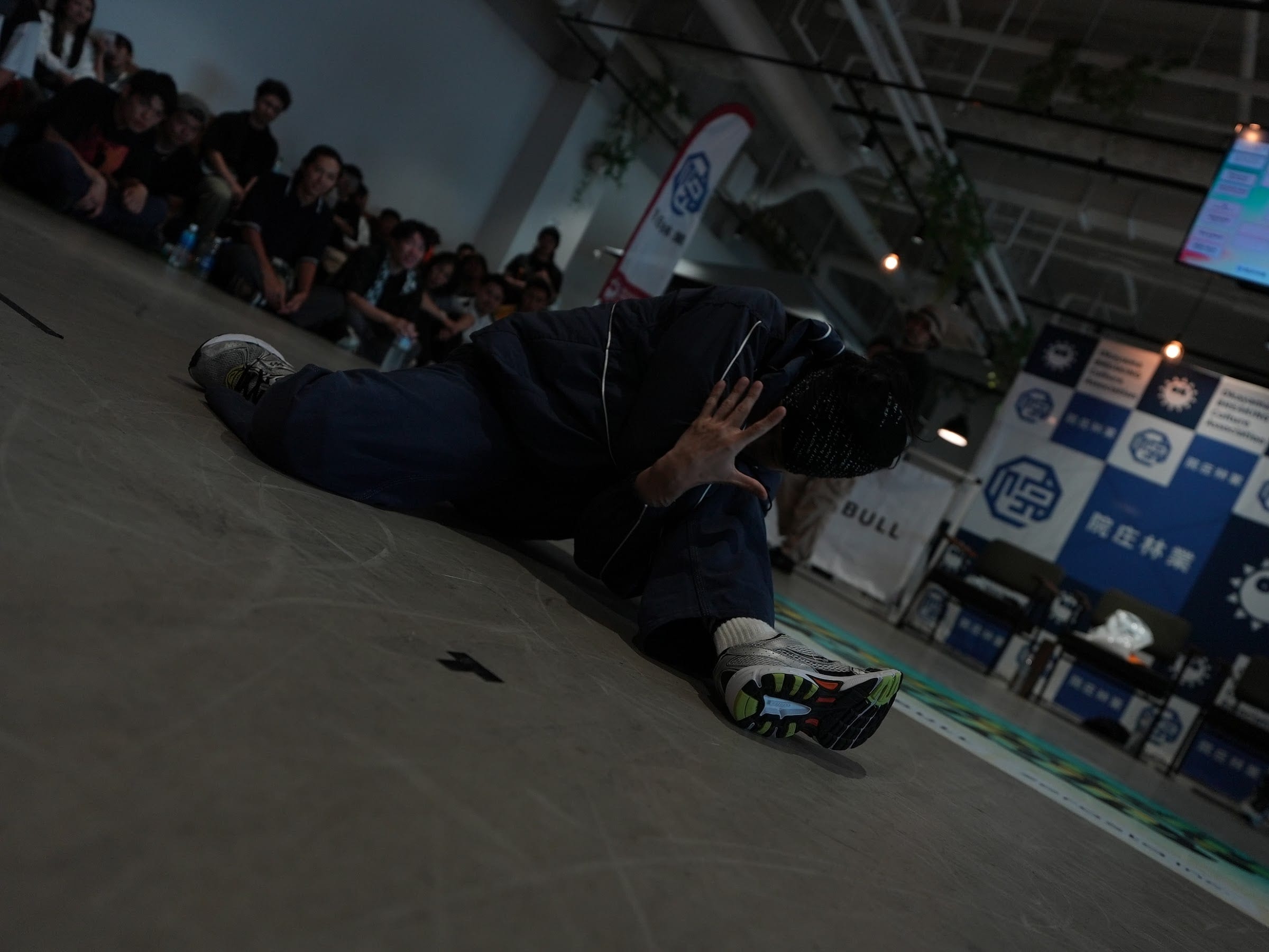 Dancer in a low freeze on the brand floor