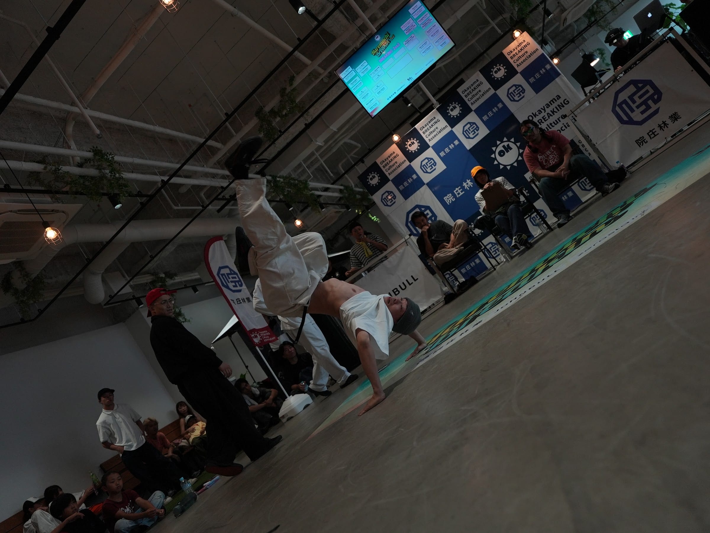 Dancer in white outfit mid-freeze